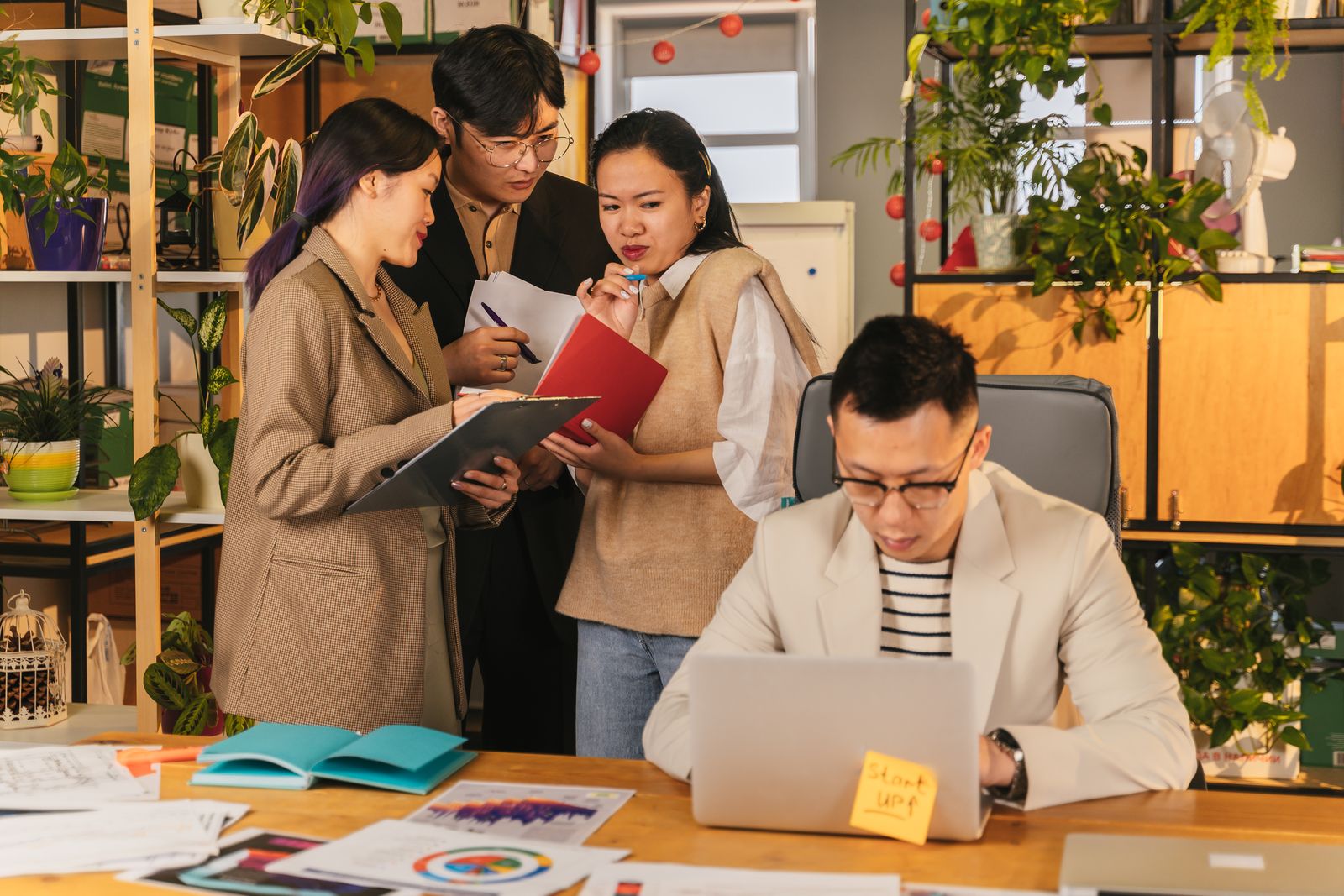 A bright office workspace with people collaborating